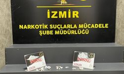 İzmir'de havalimanında vücutlarında gizledikleri uyuşturucuyla yakalanan 2 kişi tutuklandı