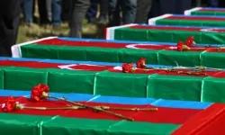Hocalı katliamının yedi kurbanının kalıntısı Hocalı'da defnedildi